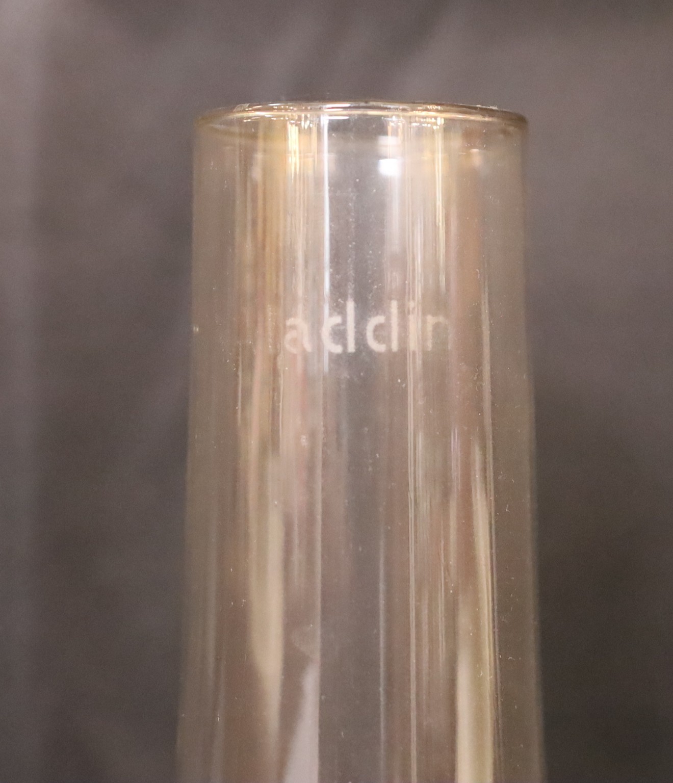 A 1930s nickel plated oil lamp with plain glass flue, height overall 68cm